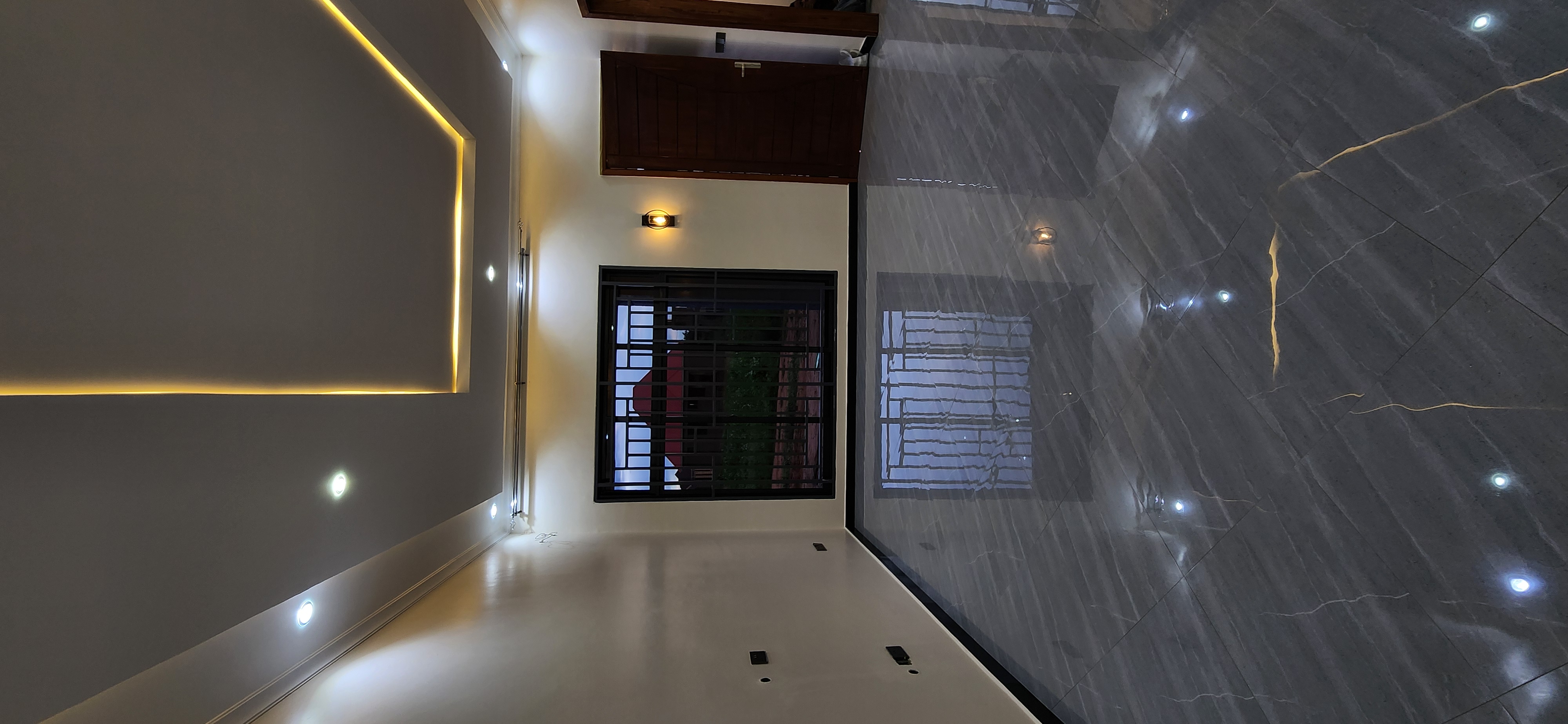 A modern home interior with polished marble floors after a Dodoma Pro Cleaners deep clean.